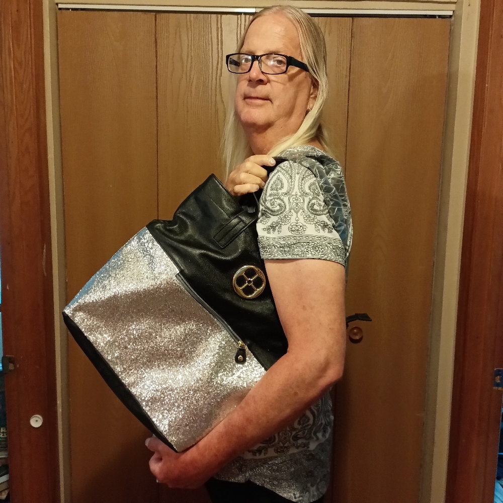 Black and silver purse. Iman brand. Brand New.